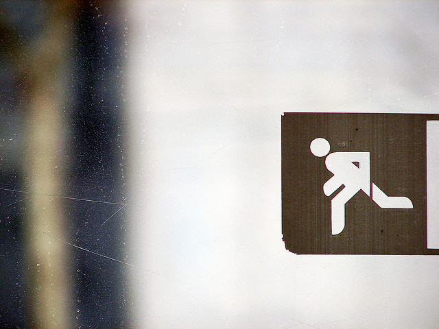 Image of sign of person running