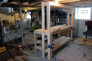 Attach top shelf to base of workbench
