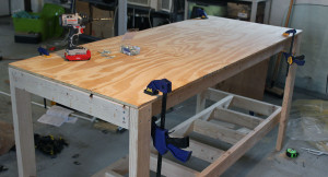 Attach top to base of workbench
