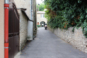 Quintessential alley with moped in Goult, France